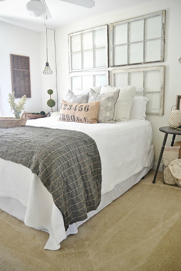 Guest Bedroom makeover on a budget! See how thrifted finds, a little paint, & some DIY made this guest bedroom lovely! 