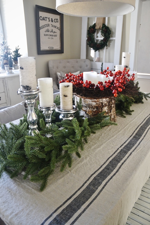 Cozy Rustic Christmas Dining Room - Christmas centerpiece, DIY wreaths, candles, texture, & more. A must pin for Christmas dining room inspiration!