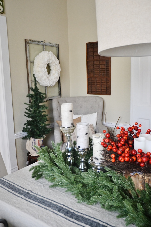 Cozy Rustic Christmas Dining Room - Christmas centerpiece, DIY wreaths, candles, texture, & more. A must pin for Christmas dining room inspiration!
