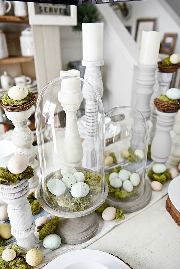 Simple Easter Dining room tablescape - rustic cottage easter decor with handmade candle holders, eggs, moss, & other touches. A must pin for Easter decor!