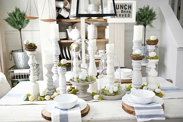 Simple Easter Dining room tablescape - rustic cottage easter decor with handmade candle holders, eggs, moss, & other touches. A must pin for Easter decor!