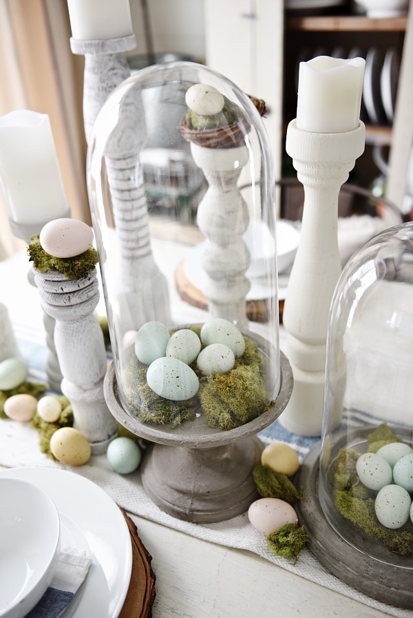 Simple Easter Dining room tablescape - rustic cottage easter decor with handmade candle holders, eggs, moss, & other touches. A must pin for Easter decor!