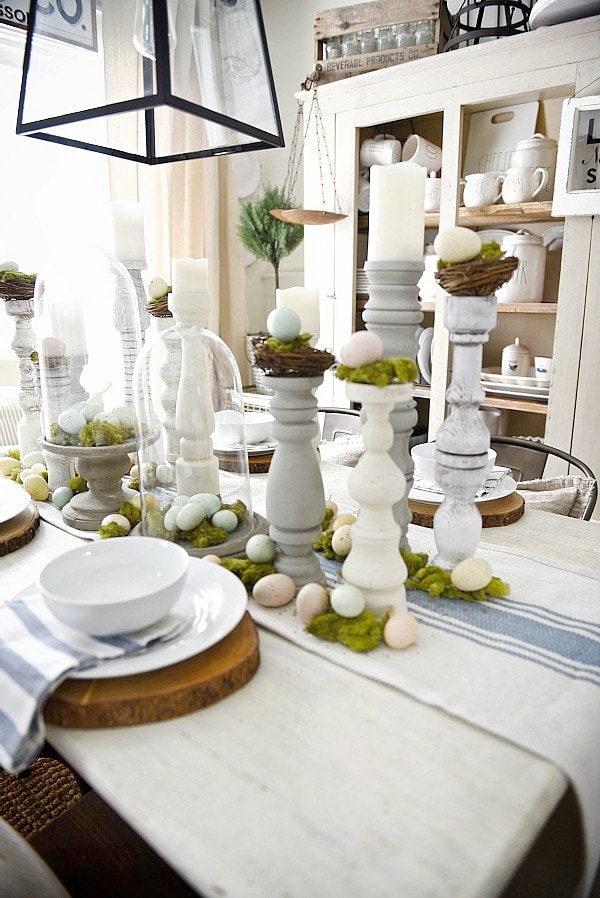 Simple Easter Dining room tablescape - rustic cottage easter decor with handmade candle holders, eggs, moss, & other touches. A must pin for Easter decor!