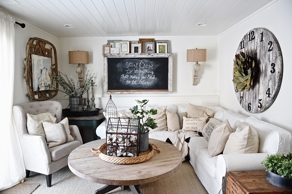 Cozy Neutral Farmhouse Style Living Room - With Ikea Ektorp Sectional. Cozy cottage style vibe makeover progress with source list of everything in the room - Great pin for neutral cozy home decor! 