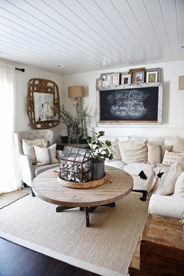Cozy Neutral Farmhouse Style Living Room - With Ikea Ektorp Sectional. Cozy cottage style vibe makeover progress with source list of everything in the room - Great pin for neutral cozy home decor! 