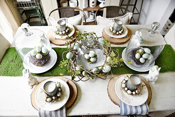Springy Easter table - Great spring & easter tablescape ideas perfect for a farmhouse or cottage style dining room. Easter wreaths, easter eggs, easter centerpiece, & more ideas! 