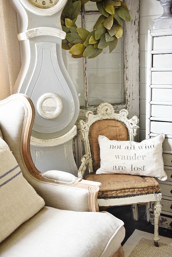 Cozy rustic cottage living room - Great pin for rustic farmhouse & cottage style decorating. A light and bright cozy living room with vintage touches like a settee, mora clock, card catalog, & so much more!