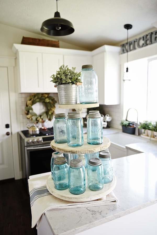 A must pin to make your own DIY three tiered tray. A super simple way to make an customizeable three tiered tray for any room in your home. Great for rustic farmhouse decor & cottage style decor kitchens. 