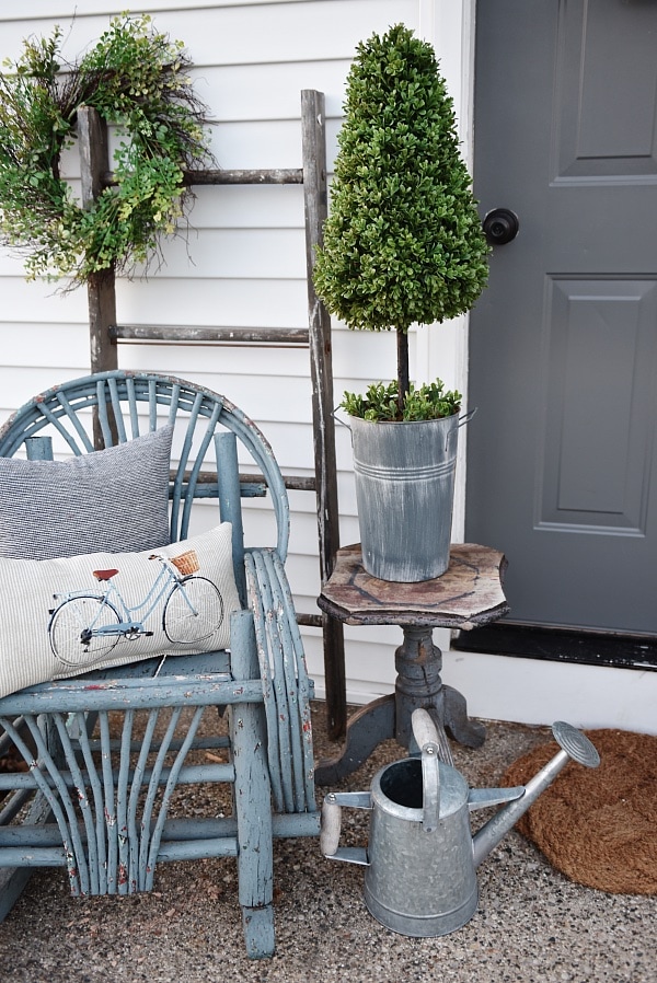 Lovely simple spring & summer porch. A great farmhouse style & cottage style front porch decor using found & new items. Pops of faux greenery so it's low maintenance too!