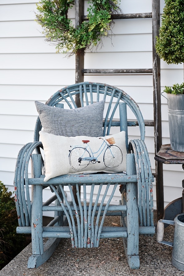 Lovely simple spring & summer porch. A great farmhouse style & cottage style front porch decor using found & new items. Pops of faux greenery so it's low maintenance too!