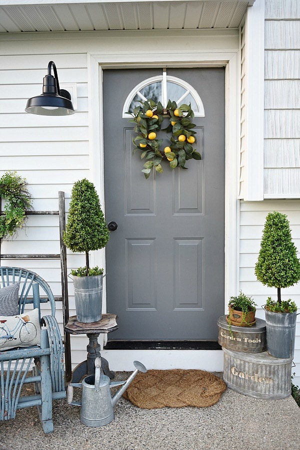 Lovely simple spring & summer porch. A great farmhouse style & cottage style front porch decor using found & new items. Pops of faux greenery so it's low maintenance too!