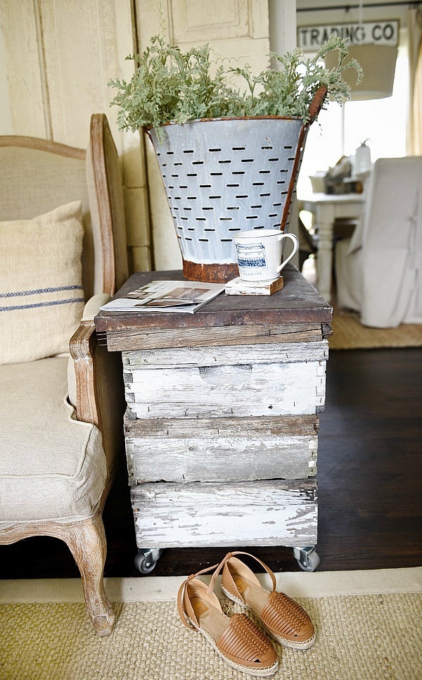 DIY rustic beehive end table - A must pin to make an easy rustic end table out of some antique finds. Great for farmhouse style living rooms!