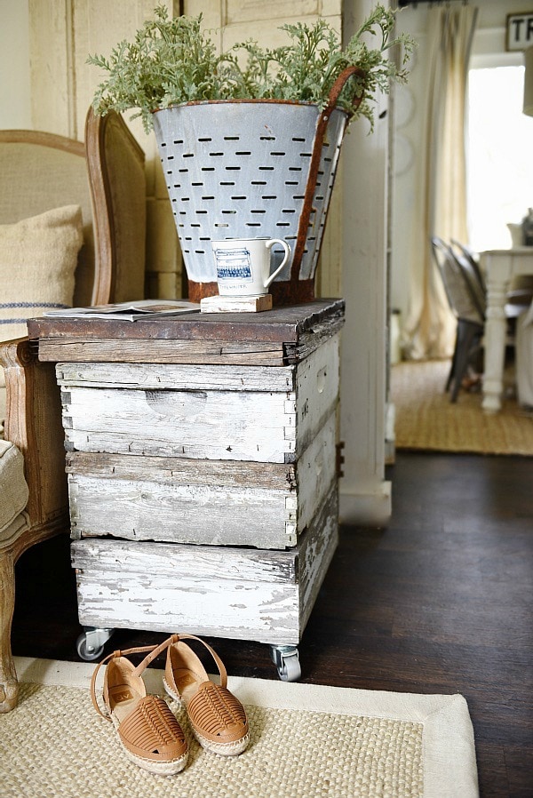 DIY rustic beehive end table - A must pin to make an easy rustic end table out of some antique finds. Great for farmhouse style living rooms!