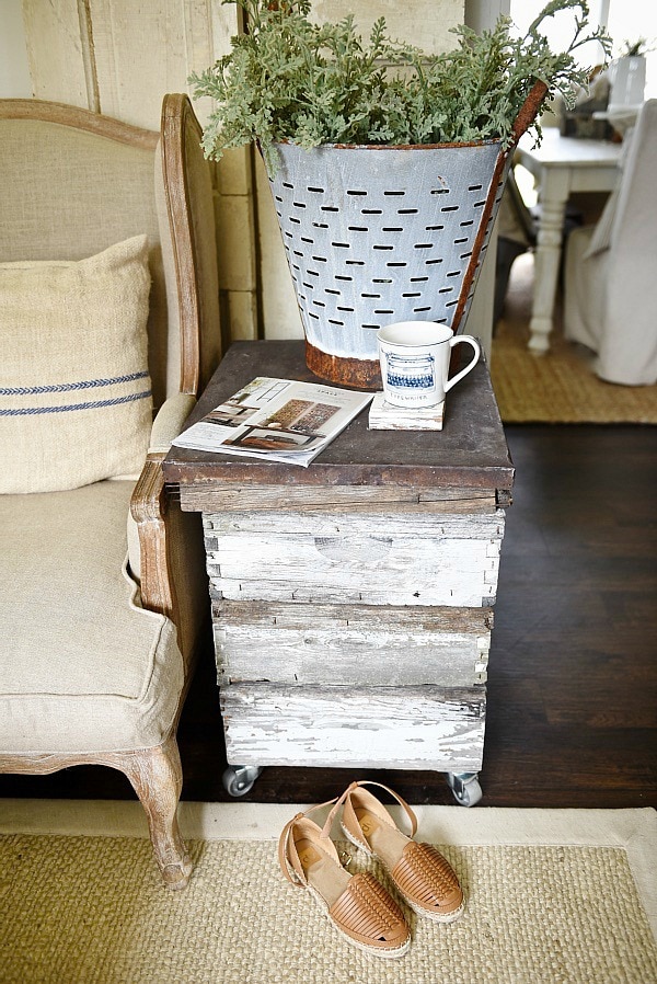 DIY rustic beehive end table - A must pin to make an easy rustic end table out of some antique finds. Great for farmhouse style living rooms!