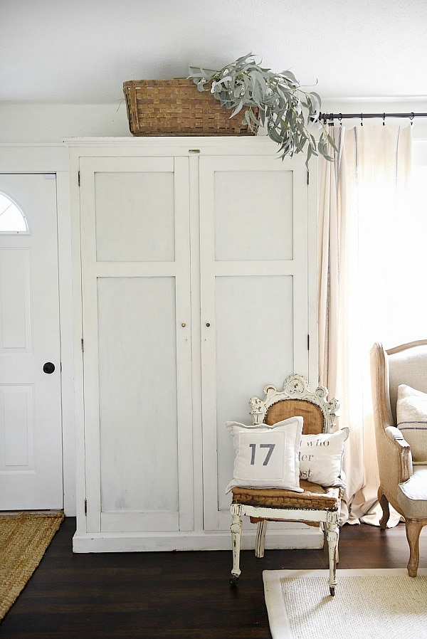 Entryway armoire - a great way to add storage to an entryway. If the closet is too small or if there isn't a closet an armoire adds amazing storage that you can hide away the mess! 