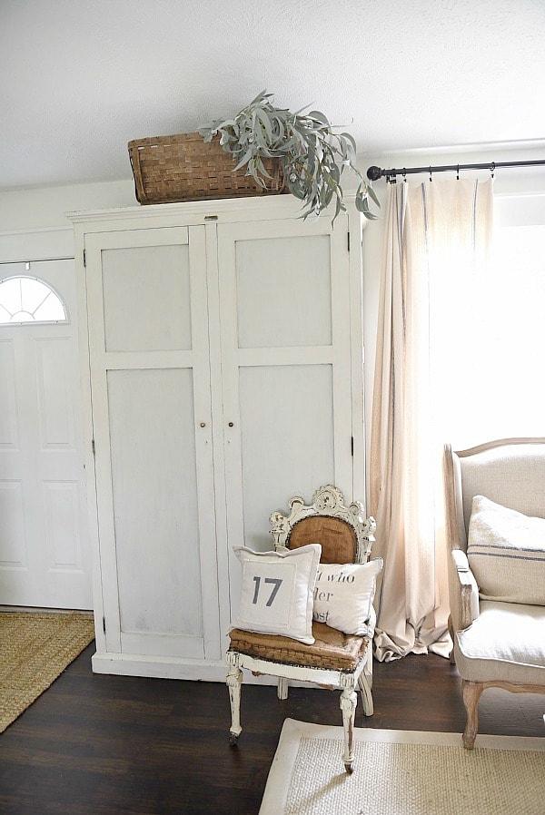 Entryway armoire - a great way to add storage to an entryway. If the closet is too small or if there isn't a closet an armoire adds amazing storage that you can hide away the mess! 