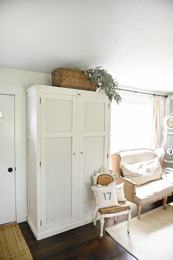 Entryway armoire - a great way to add storage to an entryway. If the closet is too small or if there isn't a closet an armoire adds amazing storage that you can hide away the mess! 