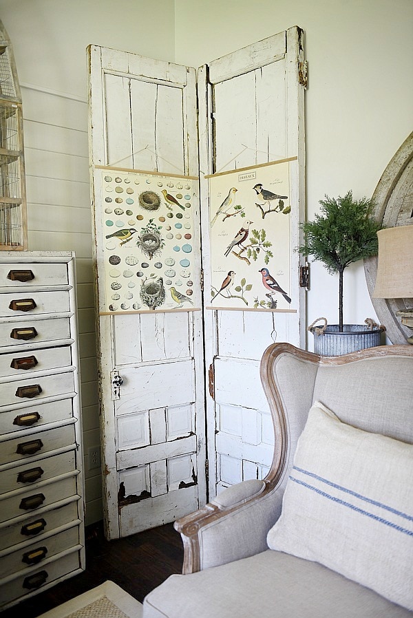 DIY Bi-fold doors in the living room to cover a wall vent. Great Farmhouse decor inspiration. & a great way to cover a wall vent!