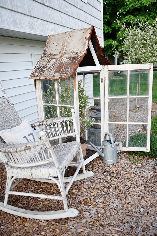 DIY window greenhouse - See how to make this amazing rustic greenhouse. A super easy DIY project that adds rustic charm indoors or outdoors. A great pin for DIY farmhouse decor! 