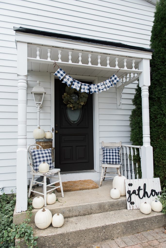 Farmhouse buffalo check fall decor on the back stoop - Great farmhouse fall decor inspiration. 