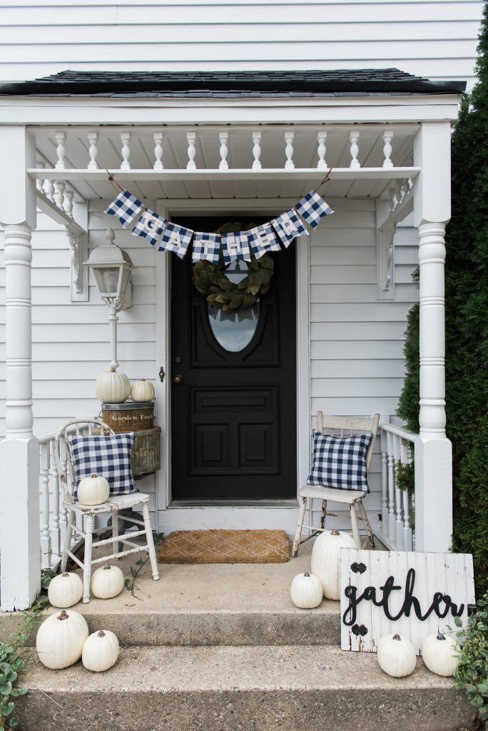 Farmhouse buffalo check fall decor on the back stoop - Great farmhouse fall decor inspiration. 