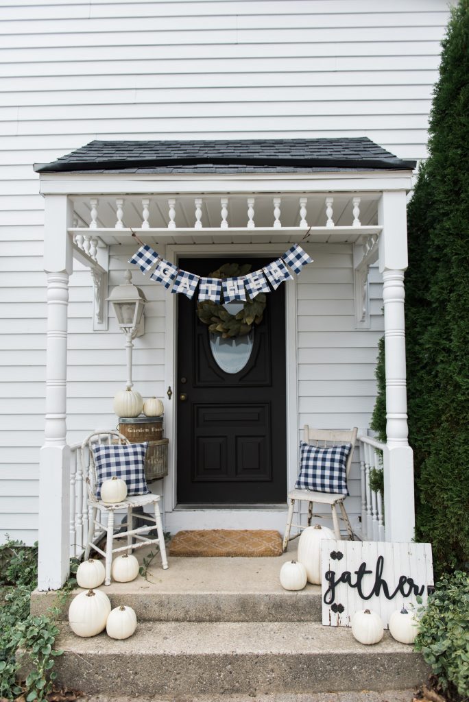 Farmhouse buffalo check fall decor on the back stoop - Great farmhouse fall decor inspiration. 