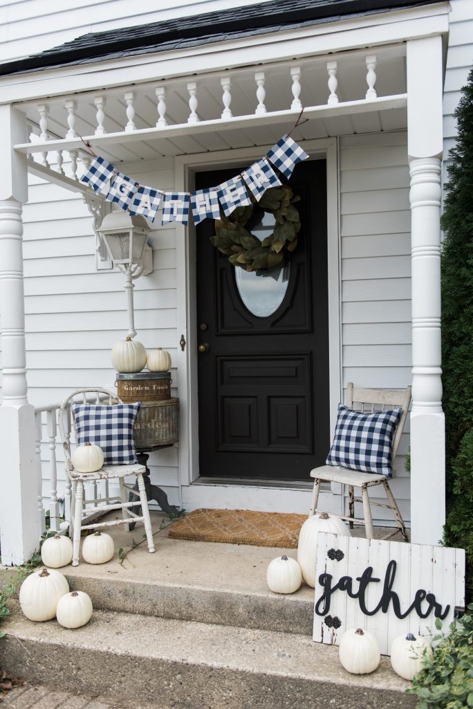 Farmhouse buffalo check fall decor on the back stoop - Great farmhouse fall decor inspiration. 
