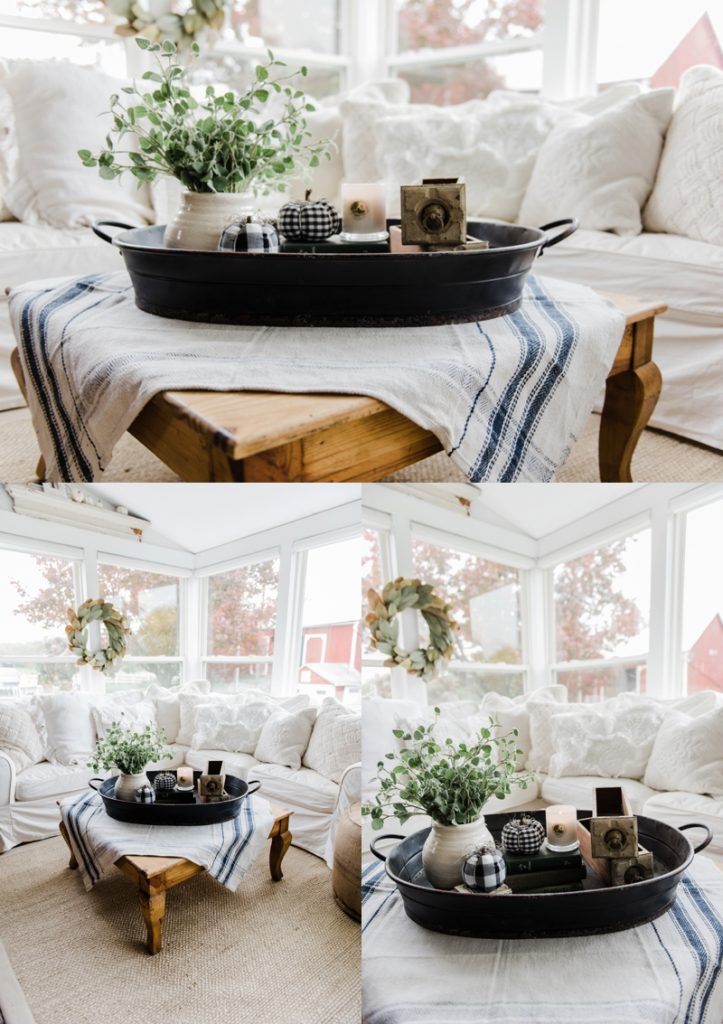 Farmhouse style coffee table in the sunroom - A lovely warm wood style coffee table style with a tablecloth on top to cozy it up. A great source for farmhouse & cottage style home decor!