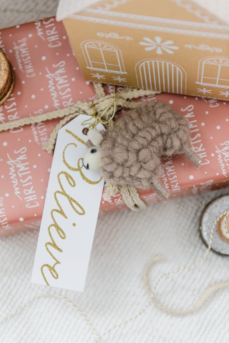 Farmhouse Gingerbread House Gift Wrap - Check out this rose gold gingerbread house gift wrap - a great pin for farmhouse & cottage style Christmas decor inspiration. 