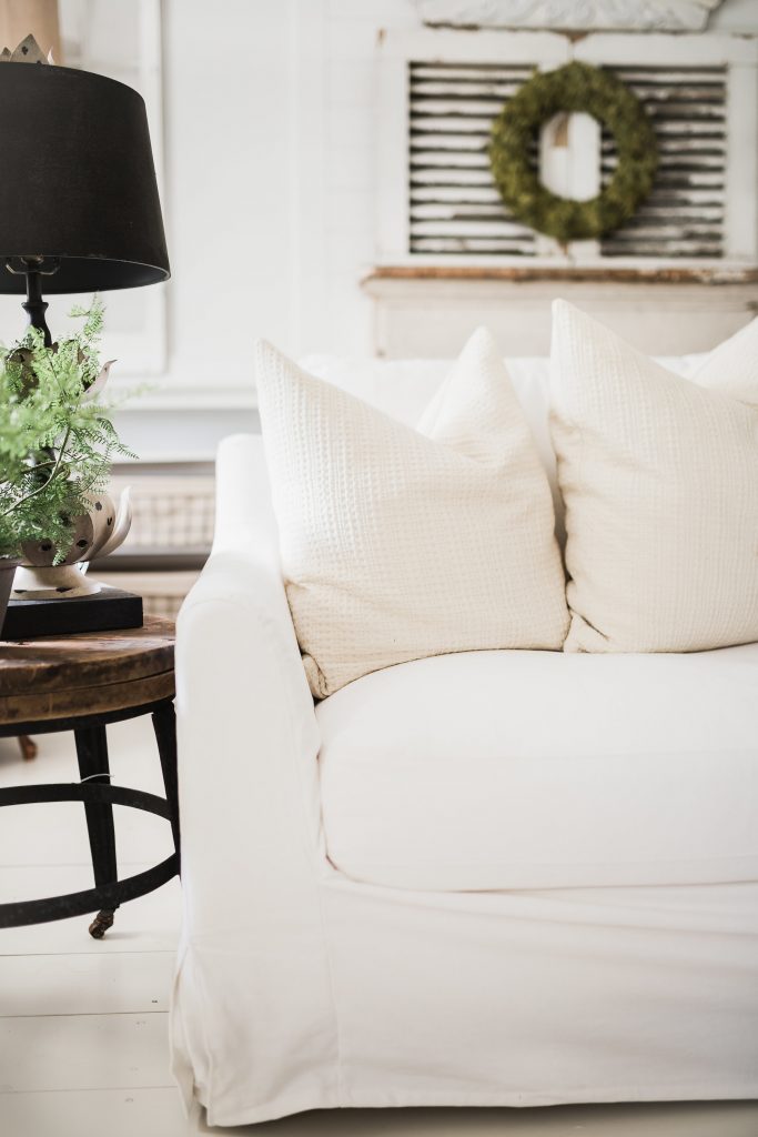 Bemz White Farmhouse Slipcover next to a rustic coffee table