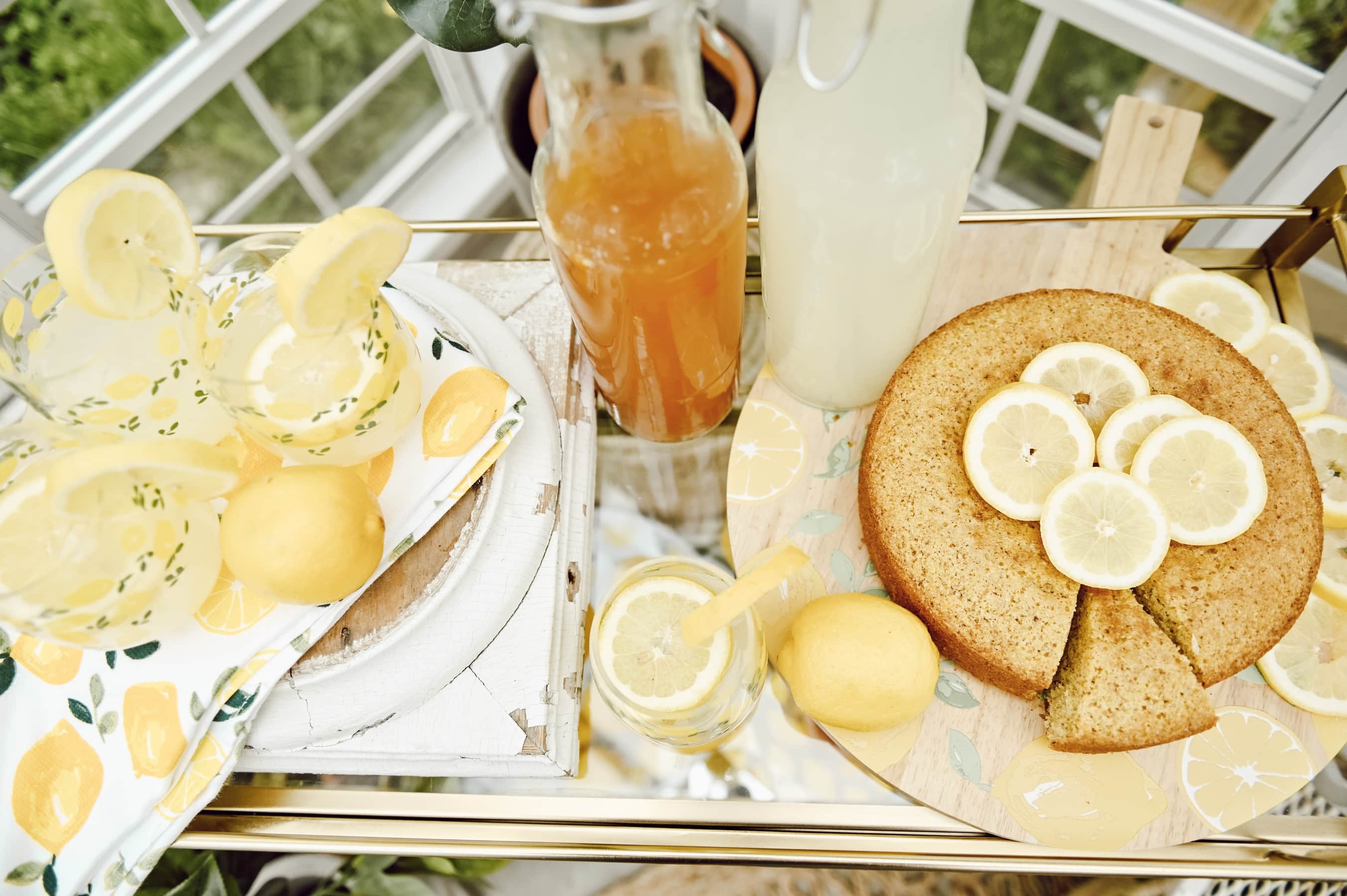 Lemon themed party with drinks, lemon cake, and lemons