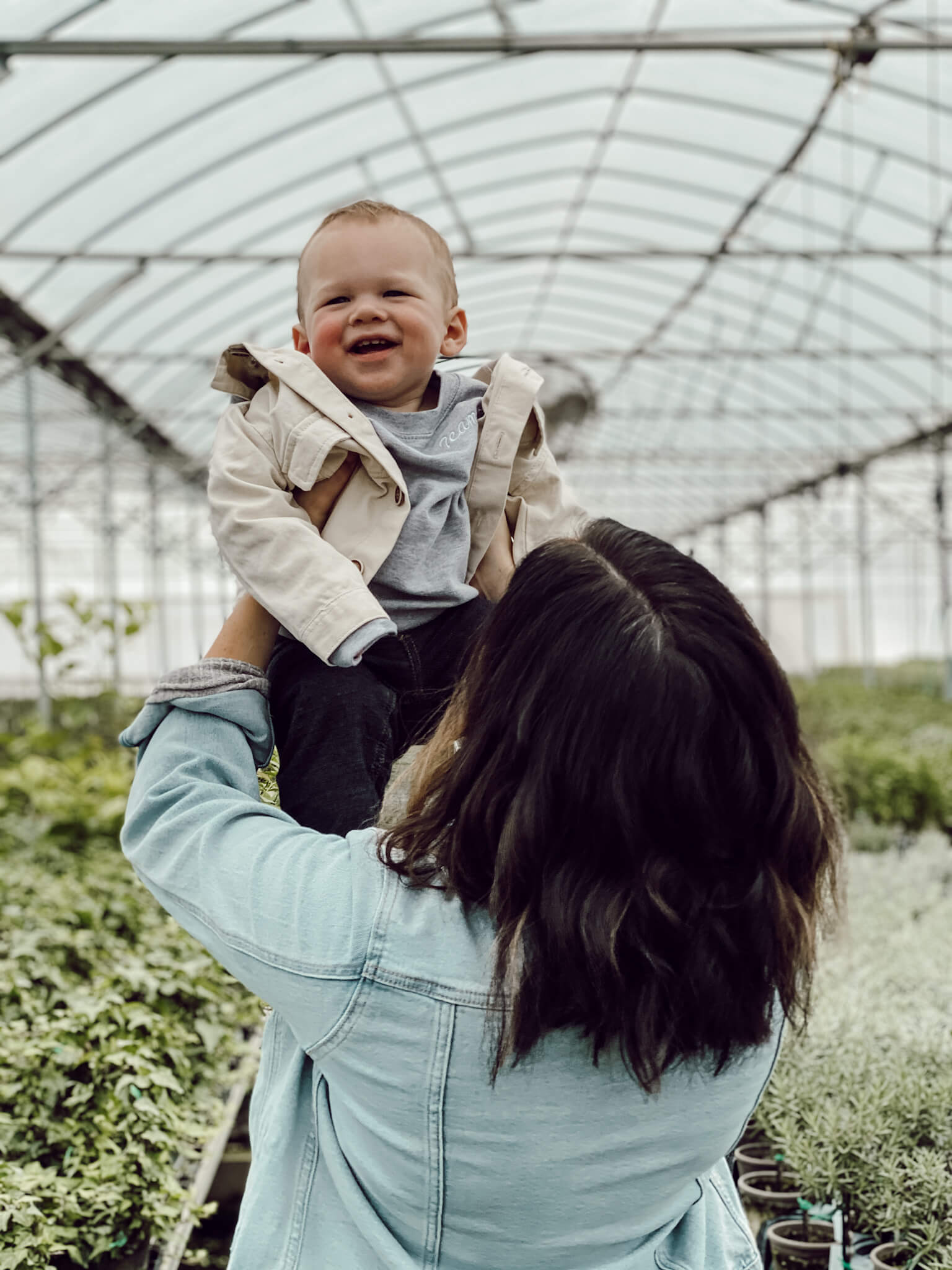 Liz Marie and Cope in a greenhouse